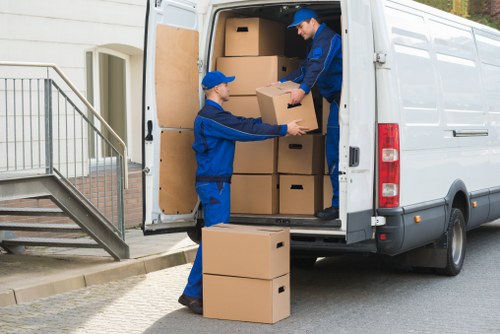 A man with a van loading furniture in Bayswater
