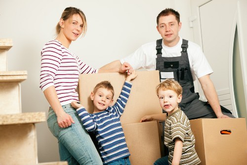 Local movers handling furniture in a Bayswater suburban home