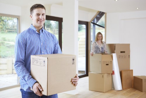Loading household furniture into a removals van in Bayswater