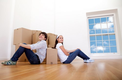 Removalists loading packed boxes and furniture for a Bayswater home move